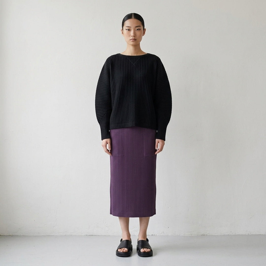me Issey Miyake Corduroy Pleats long sleeve top in black with boat neckline, sculpted pleated sleeves and cross-stitch detail at the neck - lifestyle