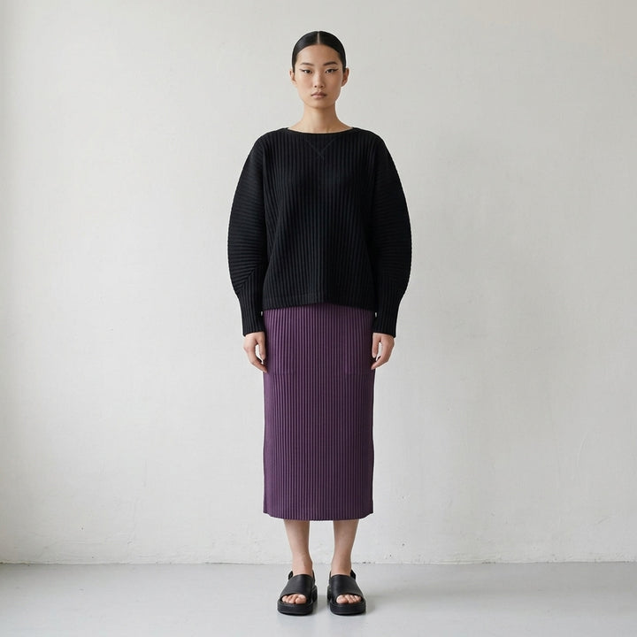 me Issey Miyake Corduroy Pleats long sleeve top in black with boat neckline, sculpted pleated sleeves and cross-stitch detail at the neck - lifestyle