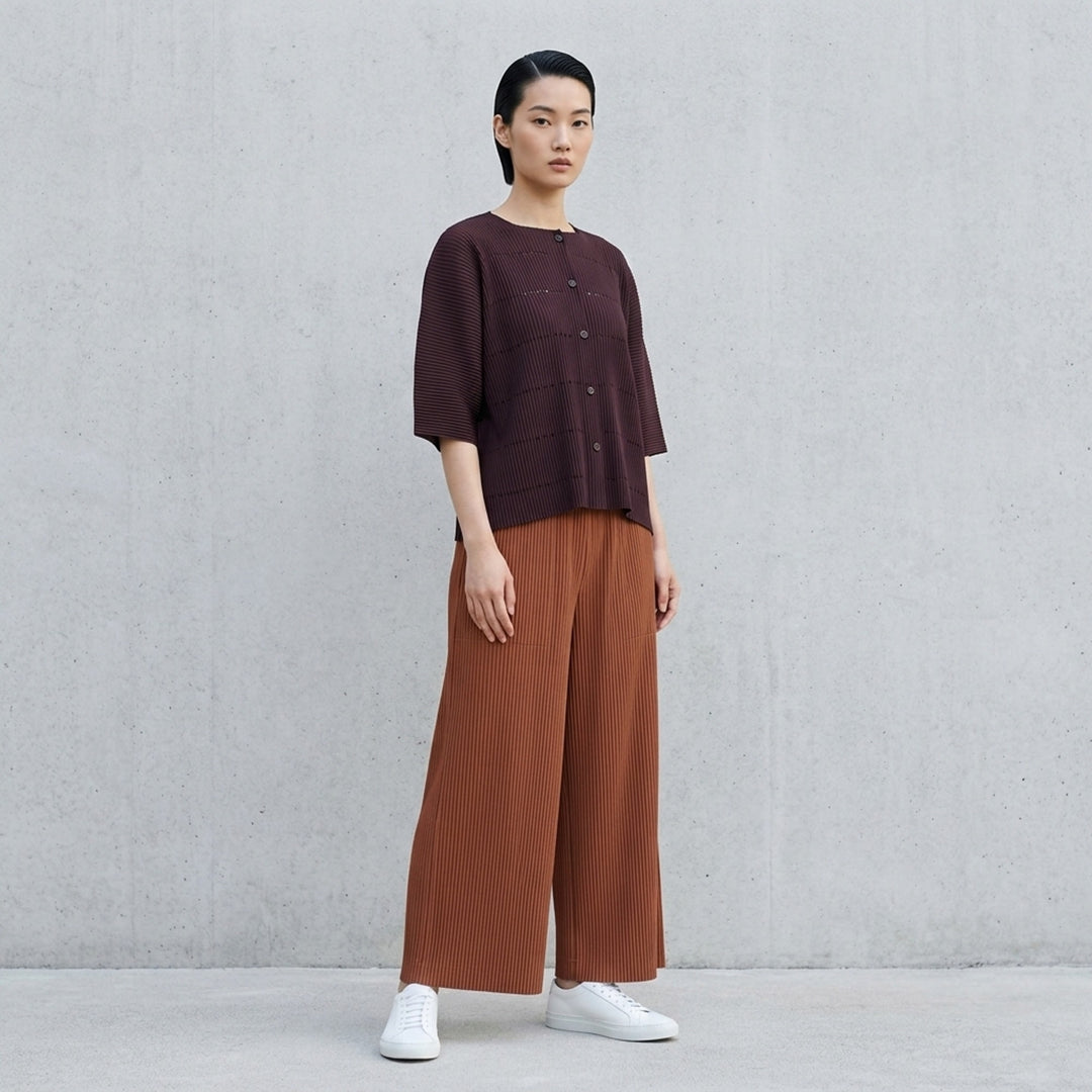 me Issey Miyake Fine Knit Pleats Color 2 wide-leg cropped pants in grey ribbed plissé knit with an elasticated waistband and front patch pockets - lifestyle
