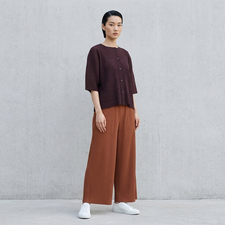 me Issey Miyake Fine Knit Pleats Color 2 wide-leg cropped pants in grey ribbed plissé knit with an elasticated waistband and front patch pockets - lifestyle