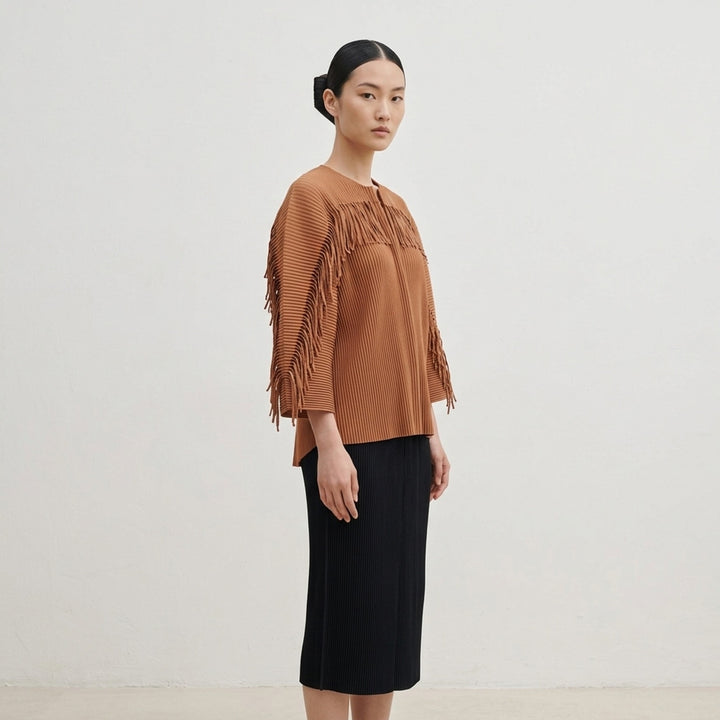 me Issey Miyake Leaf Pleats Cardigan in black, back view, showing tonal button closure, all-over relief pleating, wide sleeves with tie cuffs, and relaxed cropped silhouette - lifestyle