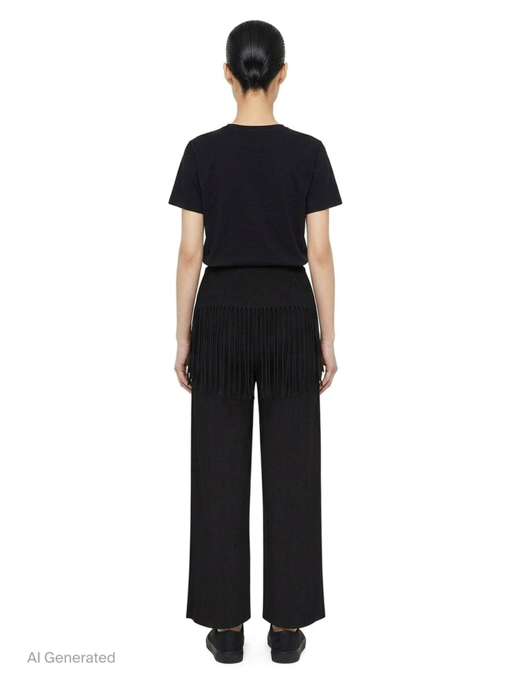 me Issey Miyake Leaf Pleats Pants in black — rear view showing wide-leg pleated silhouette with dramatic fringe trim at the hip yoke and elasticated waistband - back