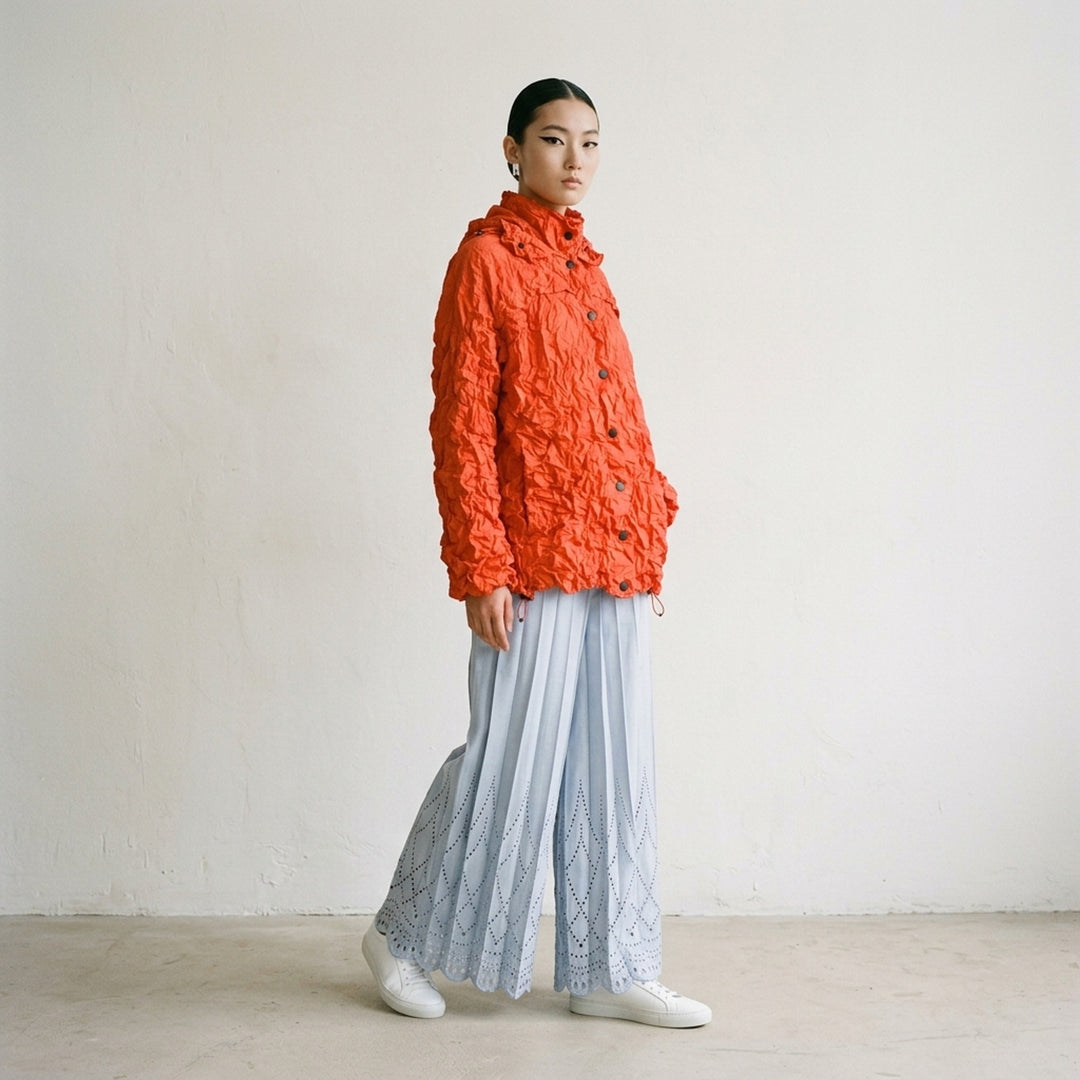 me Issey Miyake Meringue Parka in black — oversized crinkled blouson with ruched hood, snap-button front, and drawstring hem and cuffs - lifestyle