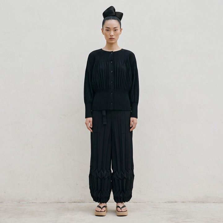 me Issey Miyake black pleated button-front cardigan with gathered waist and rounded sleeves - lifestyle