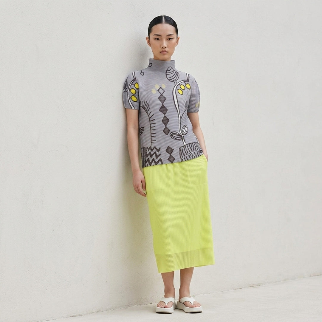 me Issey Miyake PLANT Short Sleeve Pleated Turtleneck Top in lavender grey with botanical and geometric all-over print featuring yellow accents, short puffed sleeves, and high neck - lifestyle