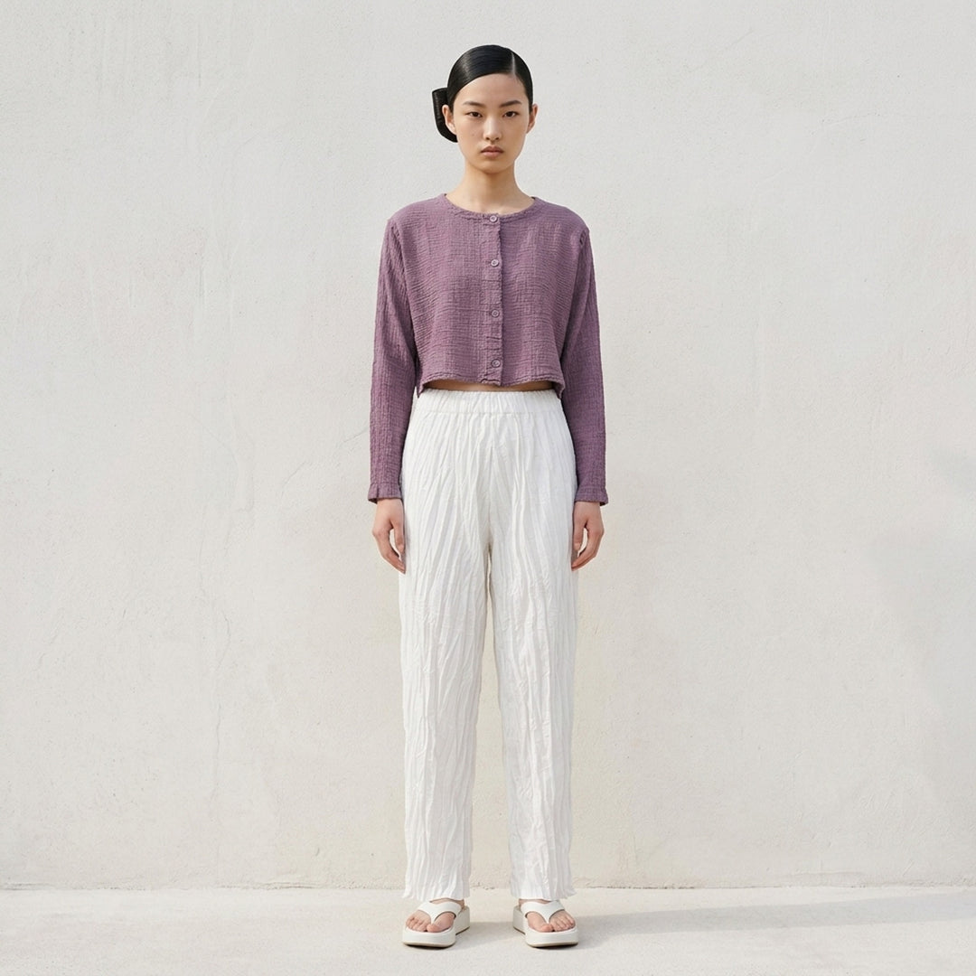 me Issey Miyake Polycotton Crepe cropped cardigan in dusty lilac with crinkled texture, round neckline and tonal button front - lifestyle