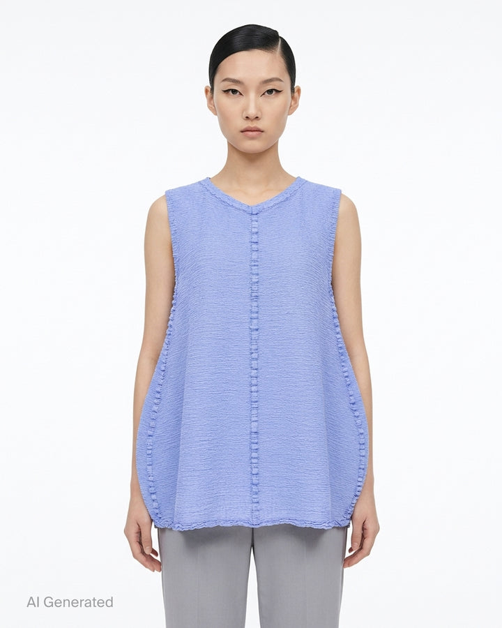 me Issey Miyake sleeveless tunic in textured polycotton crepe with ruffled centre-front seam and round neckline - front