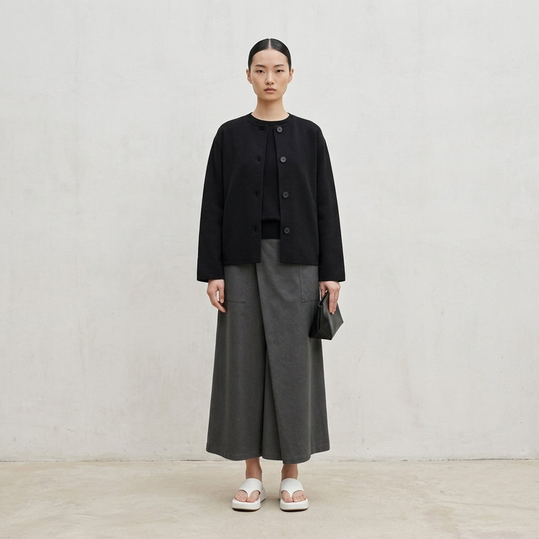 me Issey Miyake Solid Knit jacket in black with a collarless neckline, button-through front and wide sleeves - lifestyle