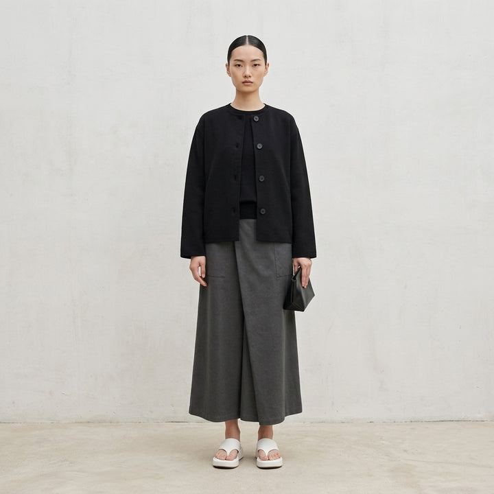 me Issey Miyake Solid Knit jacket in black with a collarless neckline, button-through front and wide sleeves - lifestyle