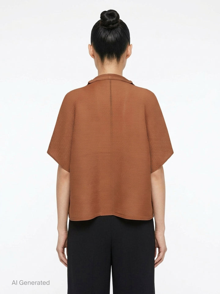 me Issey Miyake Square Stretch Pleats cardigan in black, featuring a boxy silhouette, spread collar, square micro-pleated texture, short sleeves, and single button front closure - back