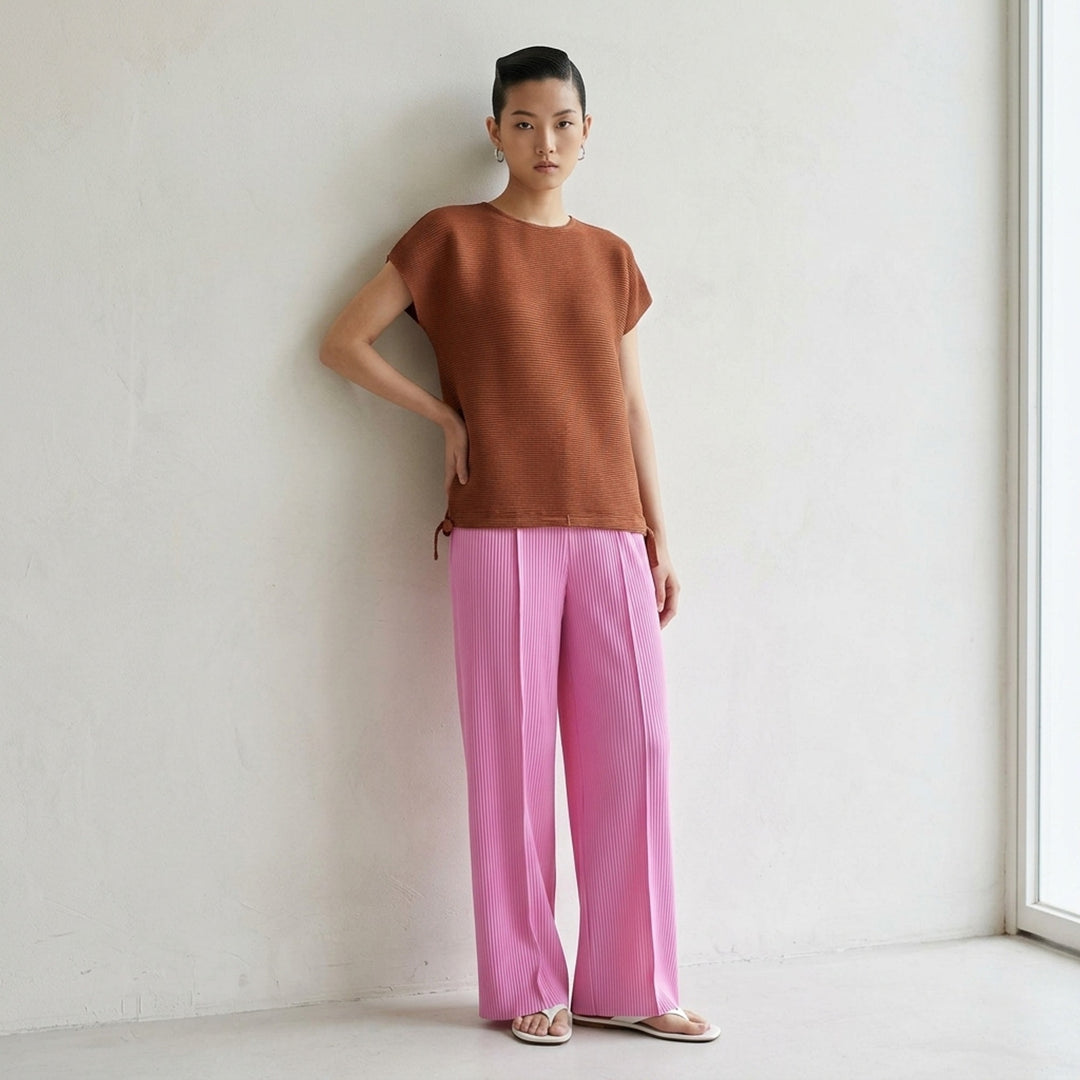 me Issey Miyake Square Stretch Pleats top in black, featuring a boxy silhouette, crew neckline, cap sleeves, and gathered tie details at the hem - lifestyle