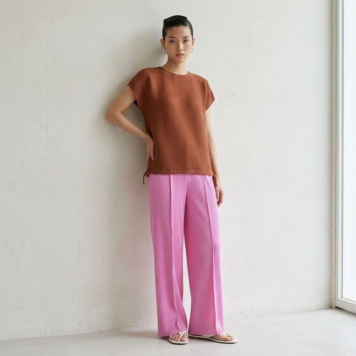 me Issey Miyake Square Stretch Pleats top in black, featuring a boxy silhouette, crew neckline, cap sleeves, and gathered tie details at the hem - lifestyle
