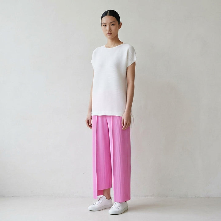 me Issey Miyake Square Stretch Pleats top in black, featuring a boxy silhouette, crew neckline, cap sleeves, and gathered tie details at the hem - lifestyle