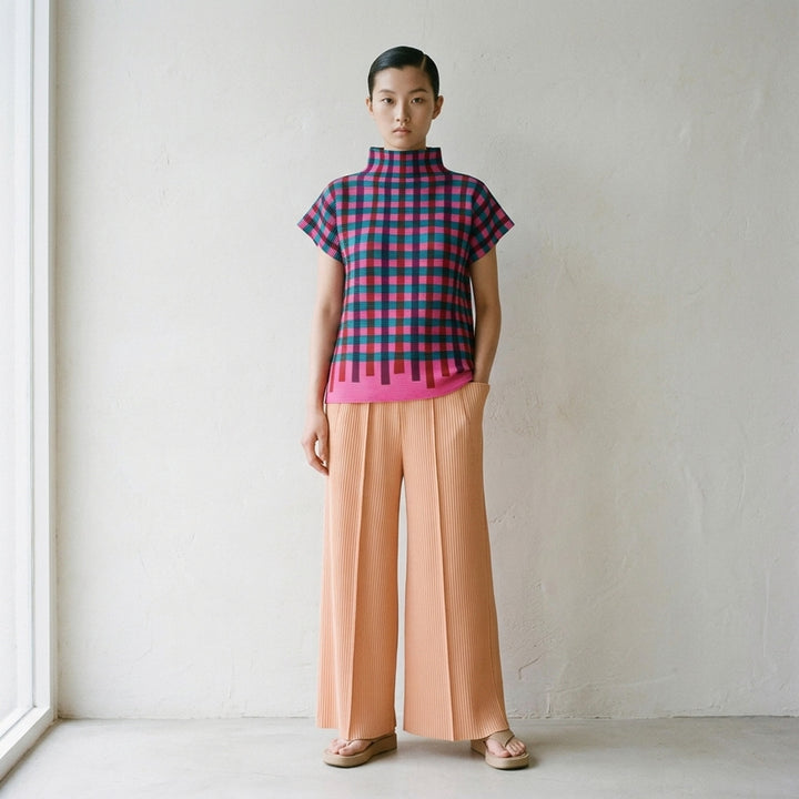 me Issey Miyake Tape Check pleated short-sleeve top with funnel neck and multicolour check print in red, purple, green, yellow and lilac - lifestyle