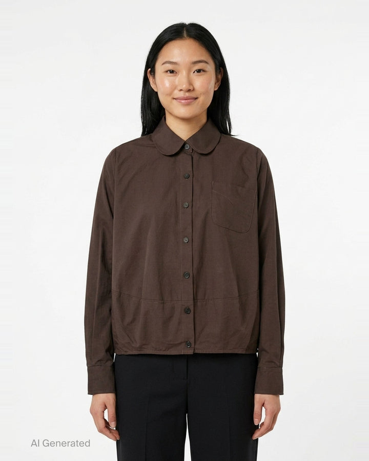 Melitta Baumeister Long Sleeve Cocoon Shirt in chocolate brown with rounded collar, contrast topstitching, chest patch pocket, and gathered elasticated hem band - front