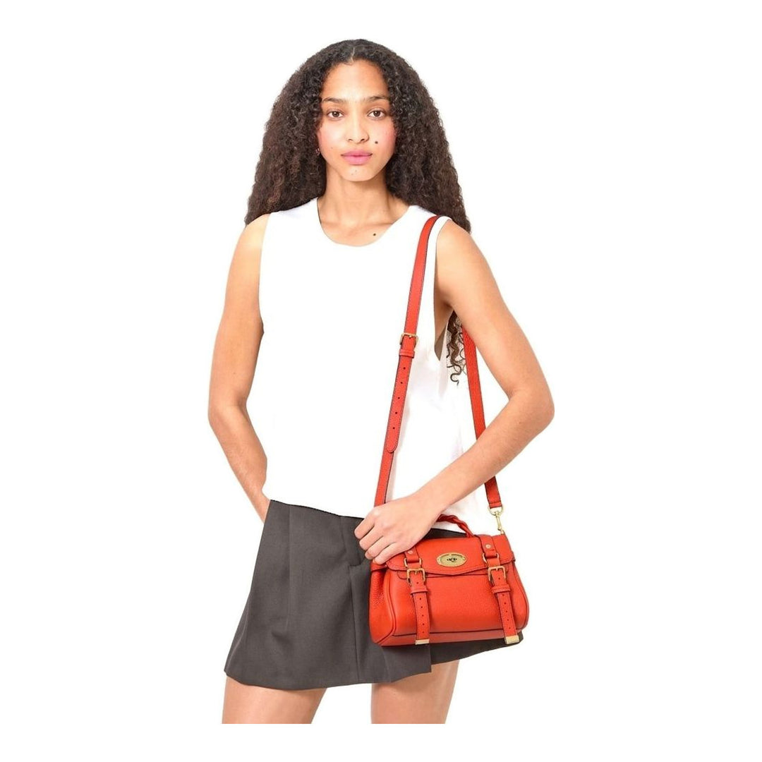 Mulberry Mini Alexa satchel in red Heavy Grain leather with braided top handle, postman's lock closure, and aged brass hardware, shown with detachable crossbody strap - packshot
