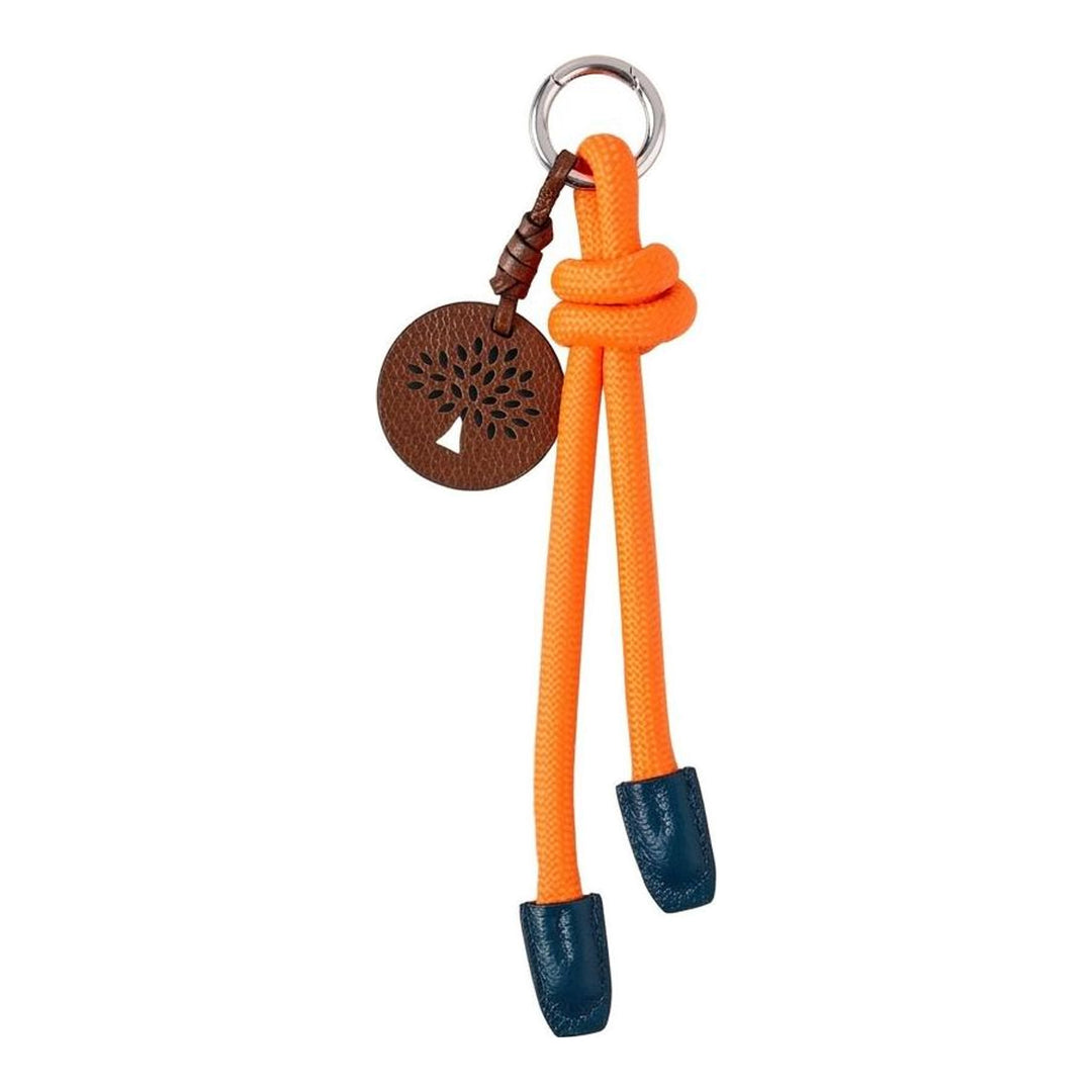 Mulberry Rope Knot Keyring in neon orange braided cord with navy leather aglets, a polished silver-tone ring, and a brown pebbled leather circular charm featuring a laser-cut mulberry tree design - packshot