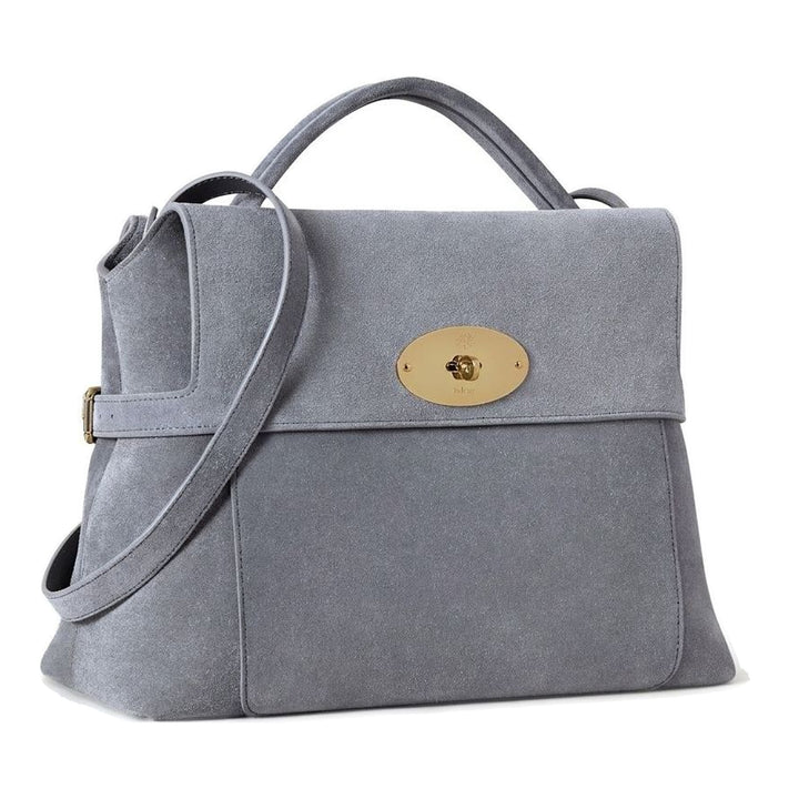 Mulberry Stevie top handle bag in grey suede with gold-tone oval postman's lock, side buckle straps and detachable crossbody strap - packshot