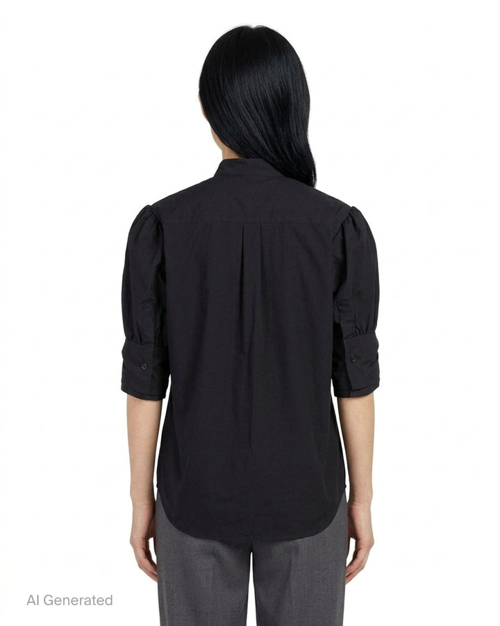Noir Kei Ninomiya black button-up shirt with band collar, oversized bow with buckle straps across the chest and puffed elbow-length sleeves - back