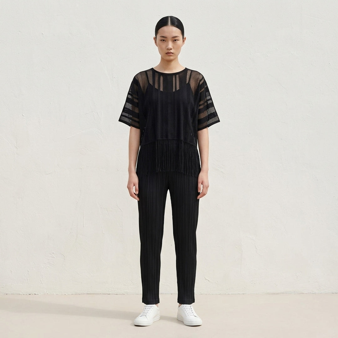 Pleats Please Issey Miyake A-POC LACE black sheer knit top with alternating mesh and solid vertical stripe panels, short sleeves, and long fringe hem detail - lifestyle