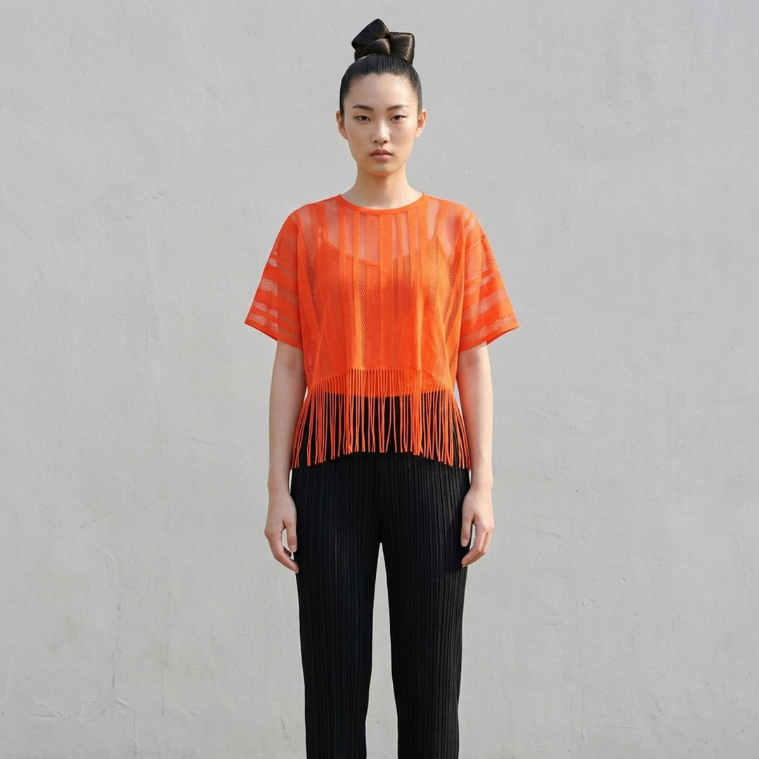 Pleats Please Issey Miyake A-POC LACE black sheer knit top with alternating mesh and solid vertical stripe panels, short sleeves, and long fringe hem detail - lifestyle