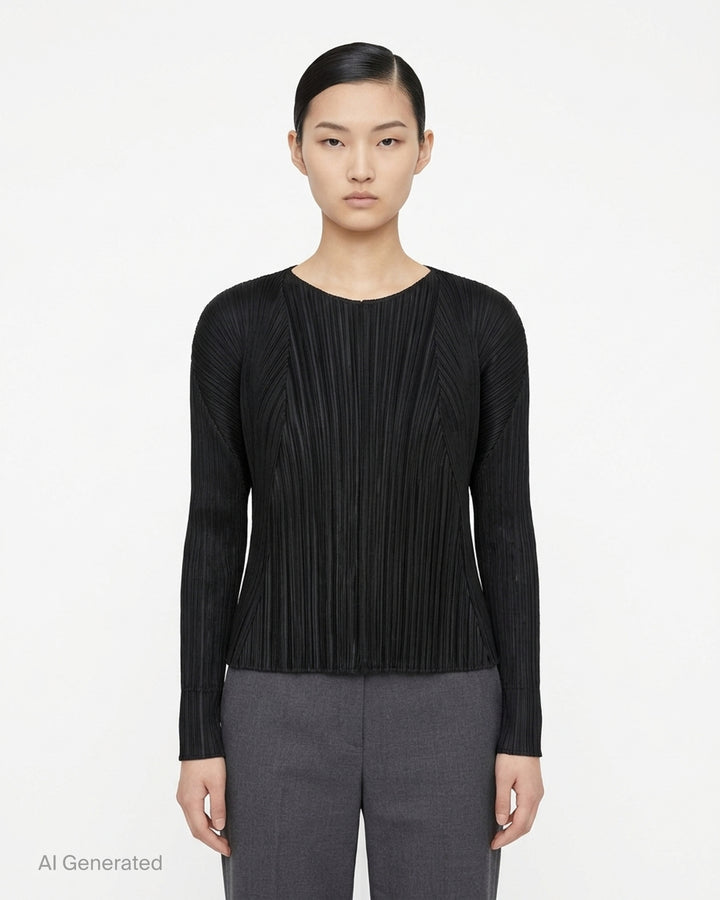 Back view of a grey pleated cardigan by Pleats Please Issey Miyake with fanning pleats and long dolman sleeves - front