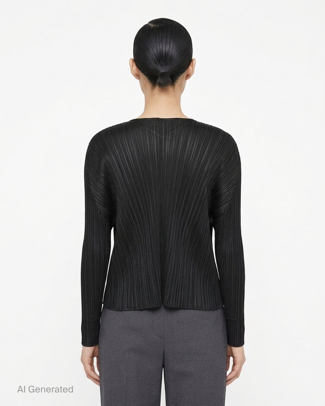 Back view of a grey pleated cardigan by Pleats Please Issey Miyake with fanning pleats and long dolman sleeves - back