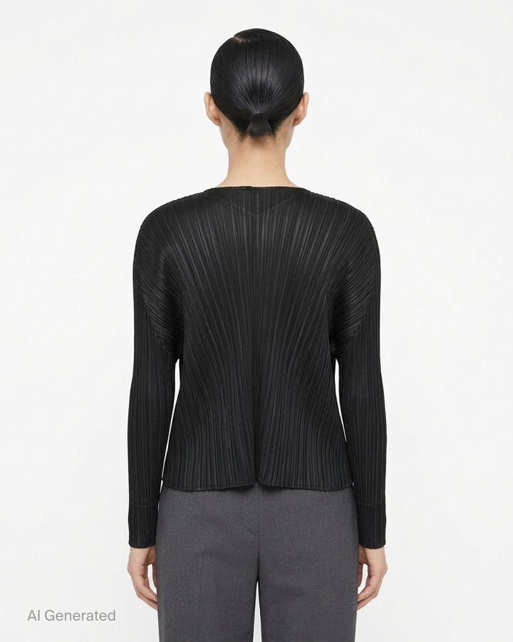 Back view of a grey pleated cardigan by Pleats Please Issey Miyake with fanning pleats and long dolman sleeves - back