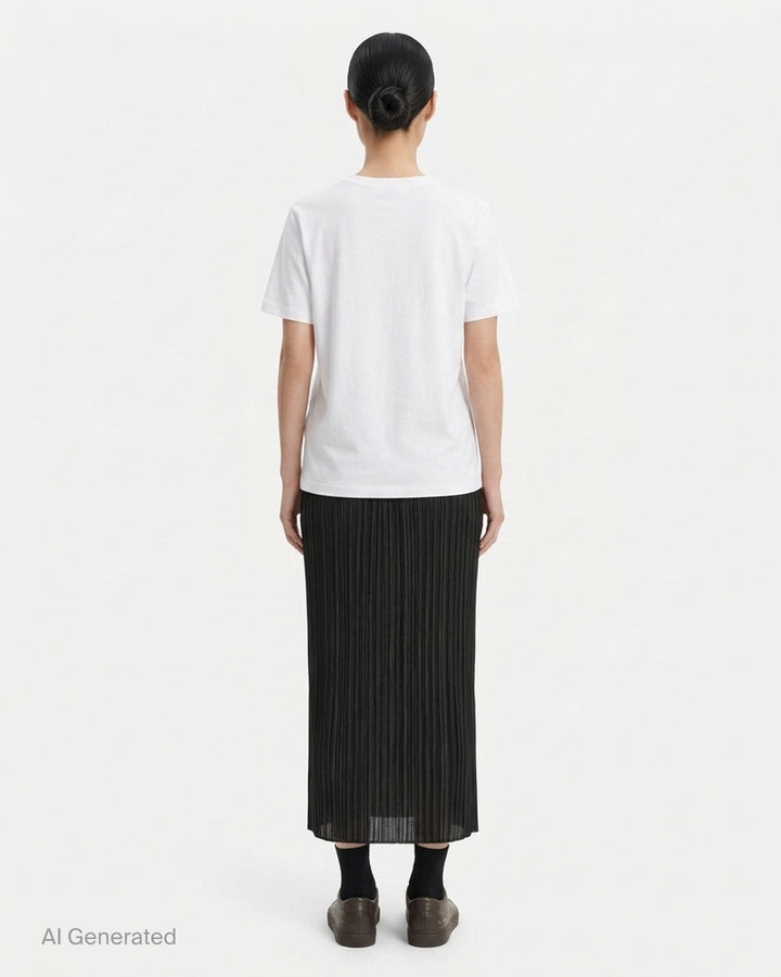 Back view of a black micro-pleated midi skirt by Pleats Please Issey Miyake with an elasticated waistband - back
