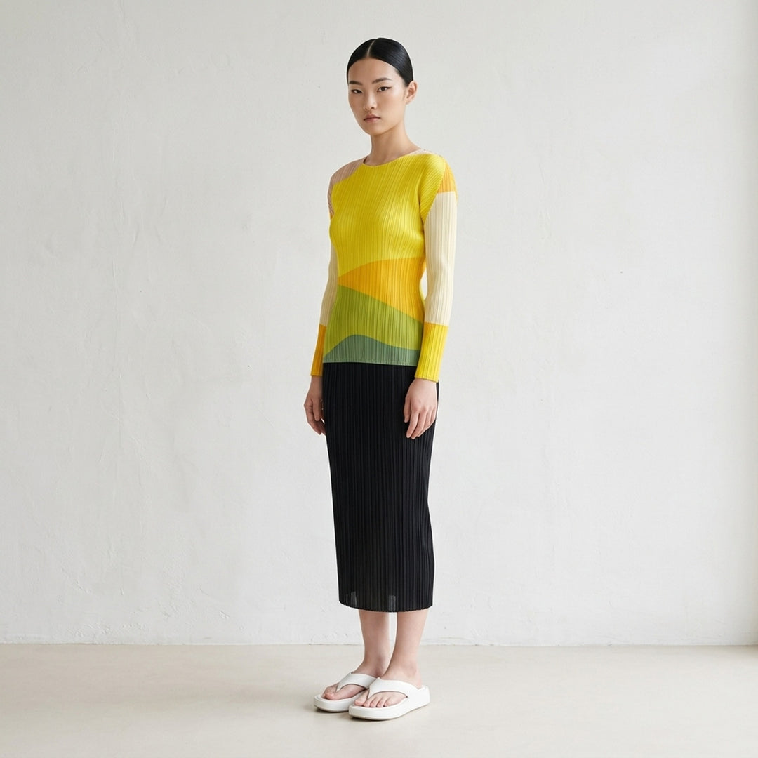 Back view of a black micro-pleated midi skirt by Pleats Please Issey Miyake with an elasticated waistband - lifestyle