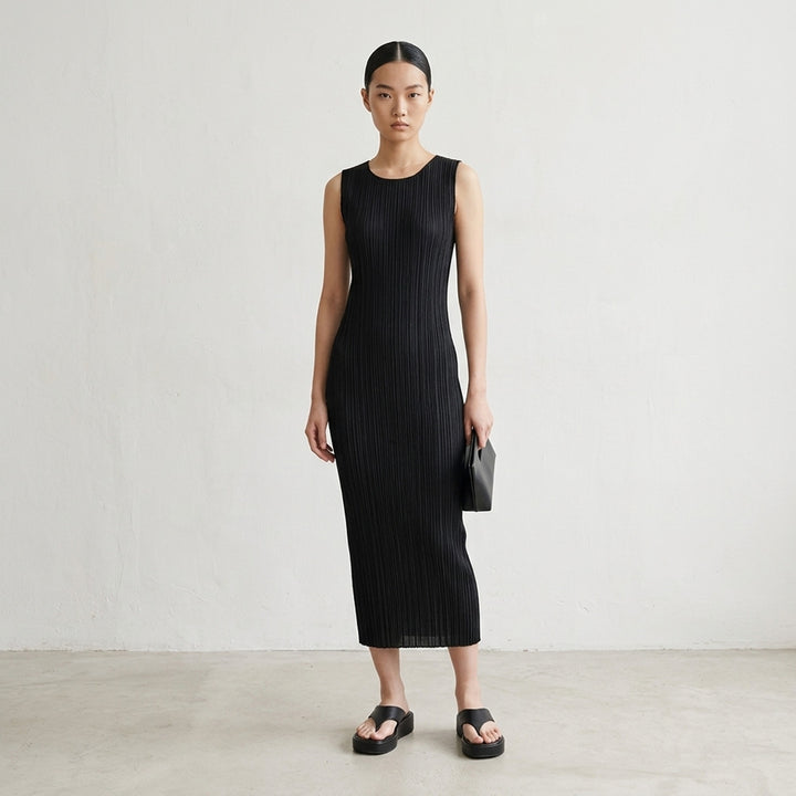 Pleats Please Issey Miyake black sleeveless pleated midi dress with scoop neckline, shown from the front - lifestyle