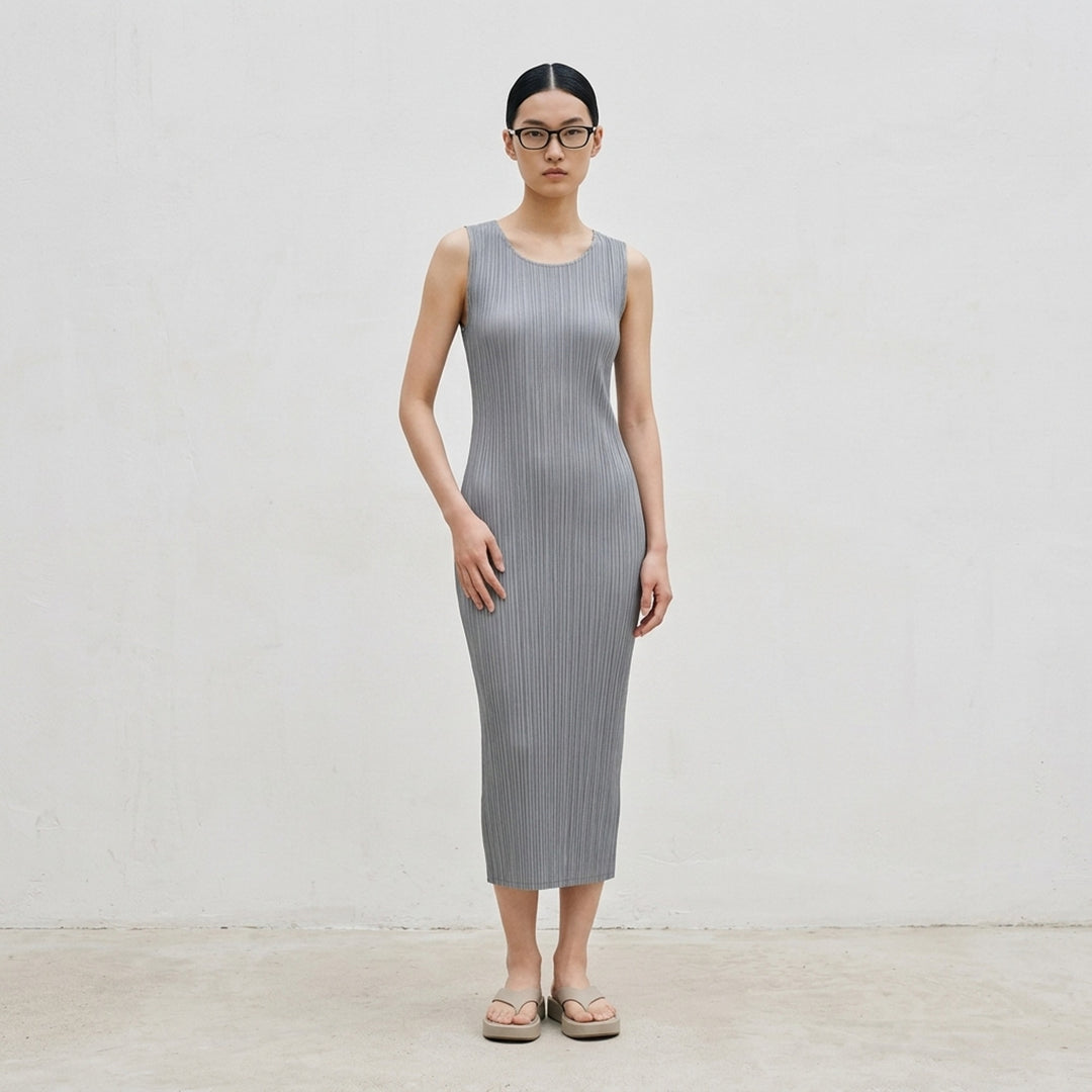 Pleats Please Issey Miyake black sleeveless pleated midi dress with scoop neckline, shown from the front - lifestyle