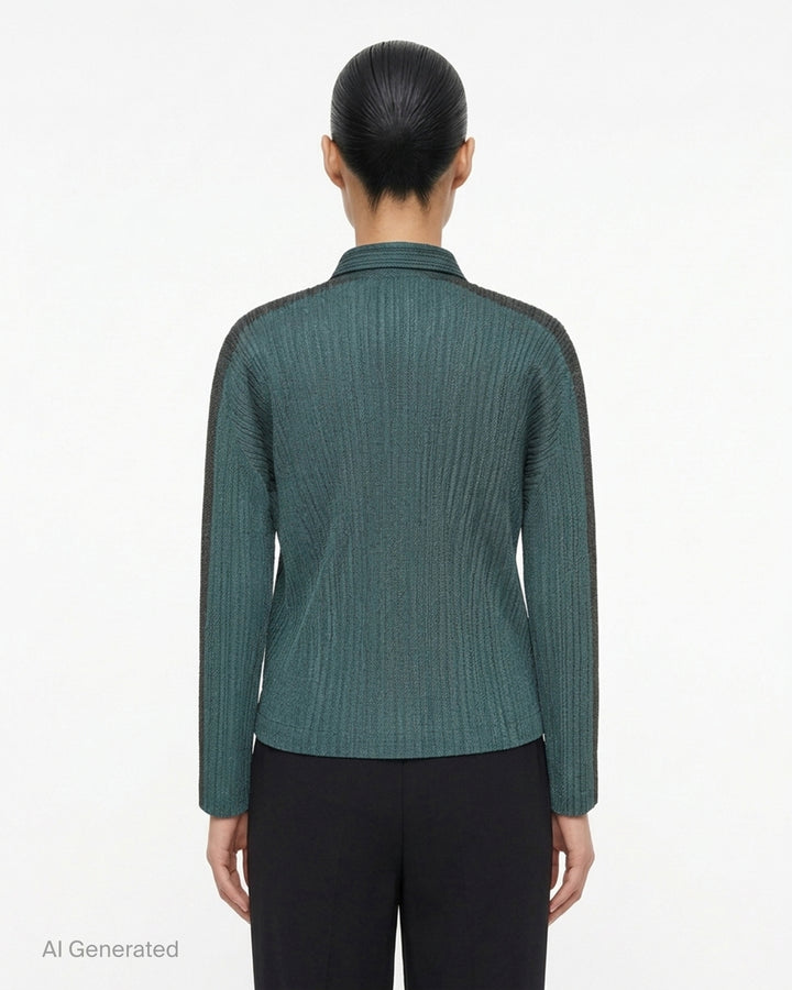 Pleats Please Issey Miyake Cotton Denim blouson in indigo blue with pleated texture, pointed collar, button front and darker shoulder panels - back