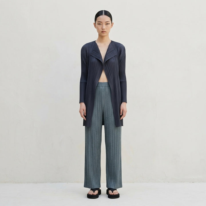 Pleats Please Issey Miyake Cotton Denim pleated wide-leg pants in textured teal-green, front view - lifestyle