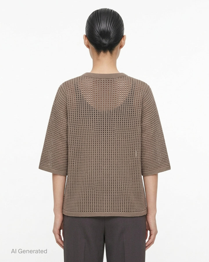 Pleats Please Issey Miyake Dot Knit — black open-work oversized half-sleeve crew neck top, shown flat from the front - back