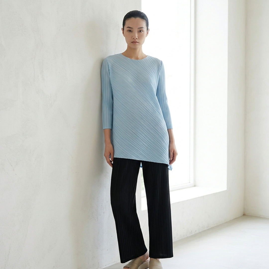 Pleats Please Issey Miyake FOLD sleeveless pleated tunic in pale blue-grey with diagonal panel seam and asymmetric hem - lifestyle