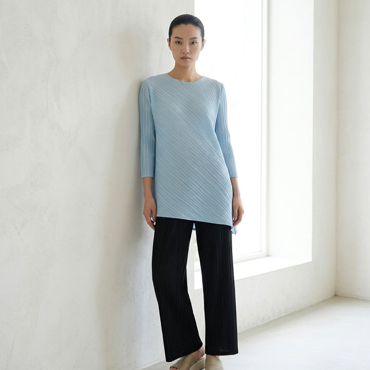 Pleats Please Issey Miyake FOLD sleeveless pleated tunic in pale blue-grey with diagonal panel seam and asymmetric hem - lifestyle