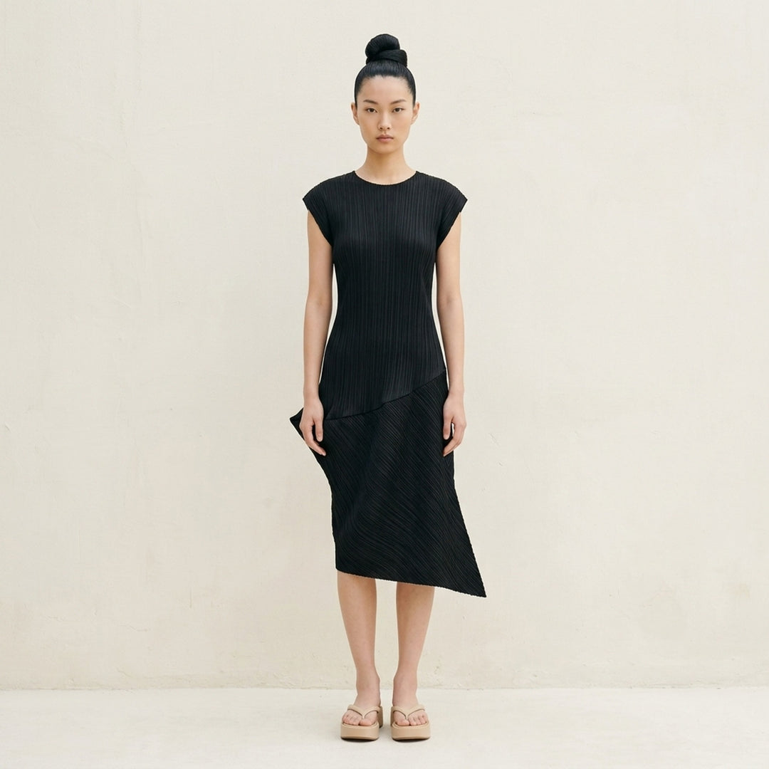 Black sleeveless pleated midi dress by Pleats Please Issey Miyake with vertical pleated bodice and asymmetric diagonal-pleated skirt - lifestyle