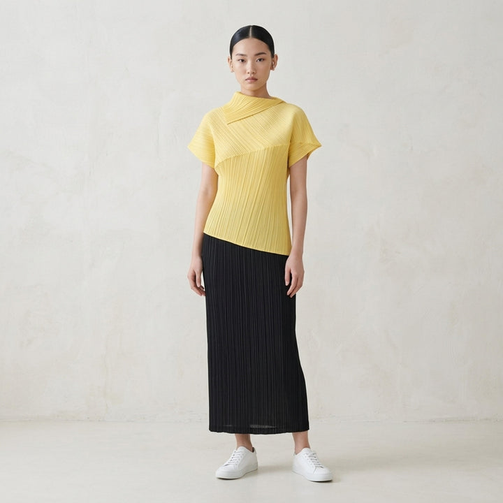Emerald green LEAP pleated top by Pleats Please Issey Miyake with asymmetric folded collar and short sleeves - lifestyle