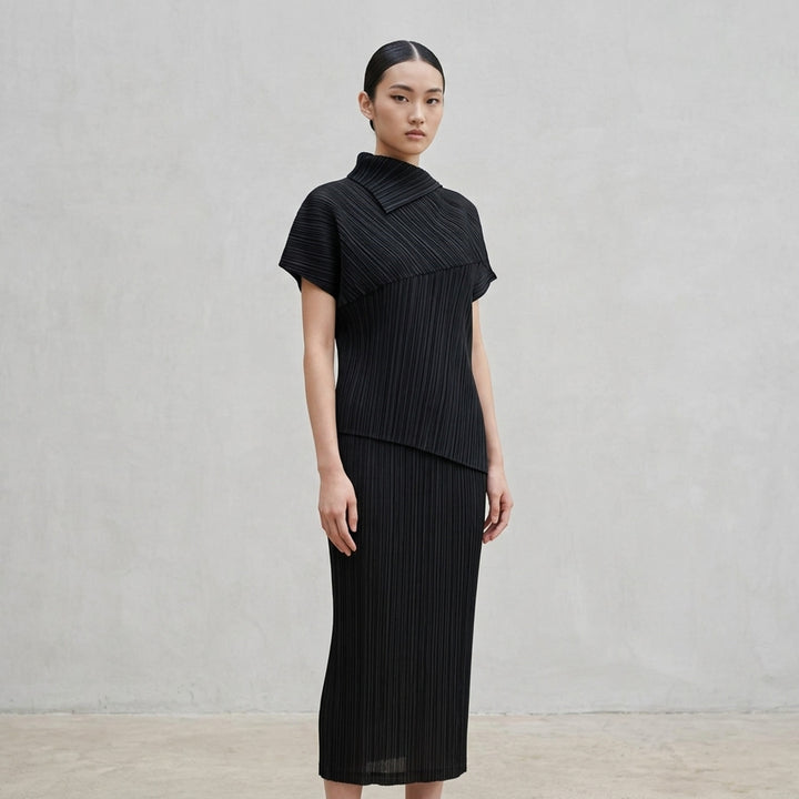 Emerald green LEAP pleated top by Pleats Please Issey Miyake with asymmetric folded collar and short sleeves - lifestyle