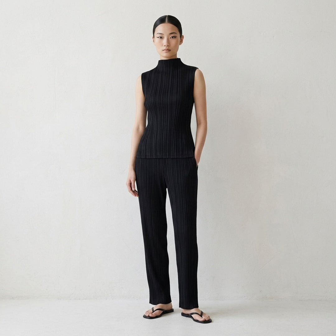 Pleats Please Issey Miyake Mellow Pleats sleeveless black mock-neck top with fine vertical pleating throughout, shown flat on a white background - lifestyle