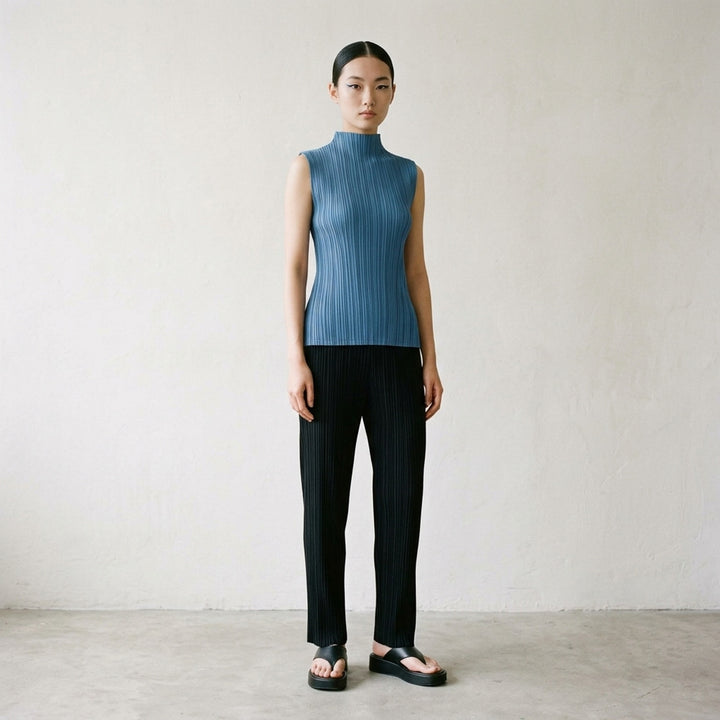 Pleats Please Issey Miyake Mellow Pleats sleeveless black mock-neck top with fine vertical pleating throughout, shown flat on a white background - lifestyle