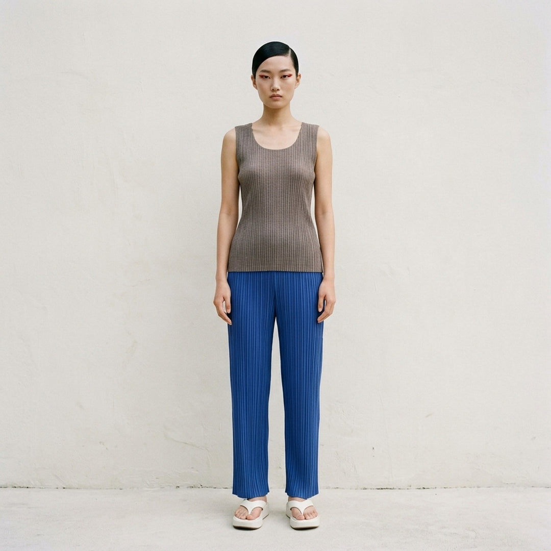 Pleats Please Issey Miyake Mist Basics Tank Top in heathered grey, featuring a fine-gauge semi-sheer ribbed knit, scoop neckline with dual-layer detail, and slim silhouette - lifestyle