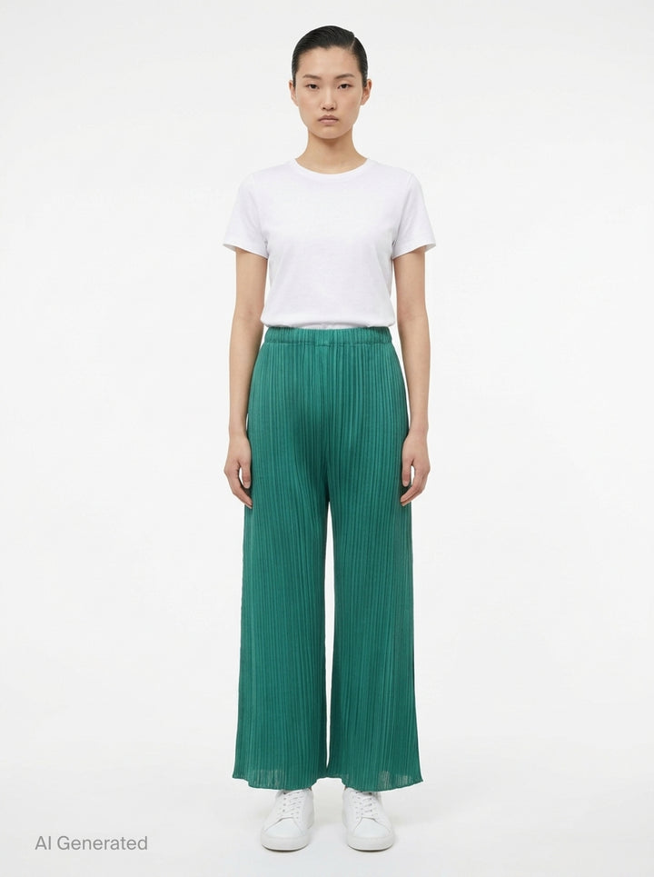 Pleats Please Issey Miyake Monthly Colors July wide-leg pleated pants in teal green with elasticated waistband and micro-pleat detailing throughout - front
