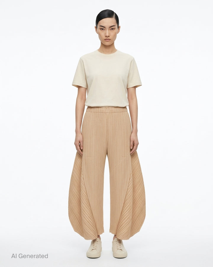 Pleats Please Issey Miyake Monthly Colors October pleated flared pants in deep green with sculpted side panels and elasticated waist - front