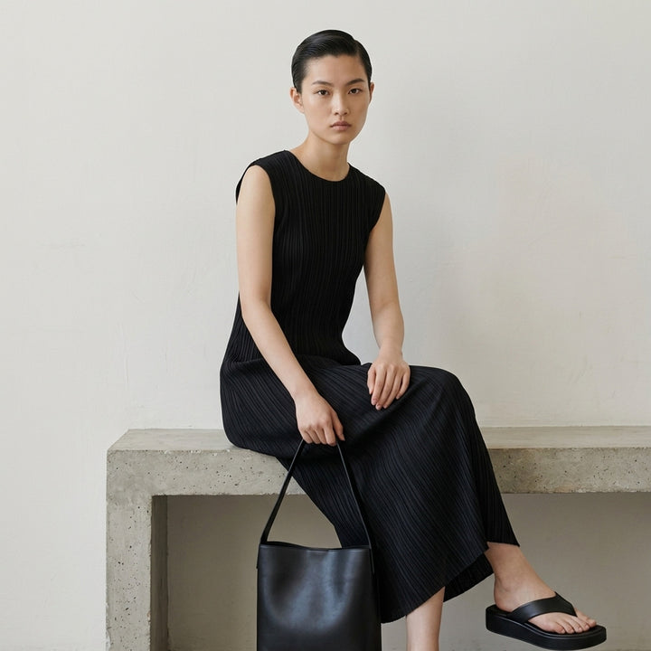 Pleats Please Issey Miyake Monthly Colors September sleeveless black midi dress with fine vertical micro-pleating throughout - lifestyle