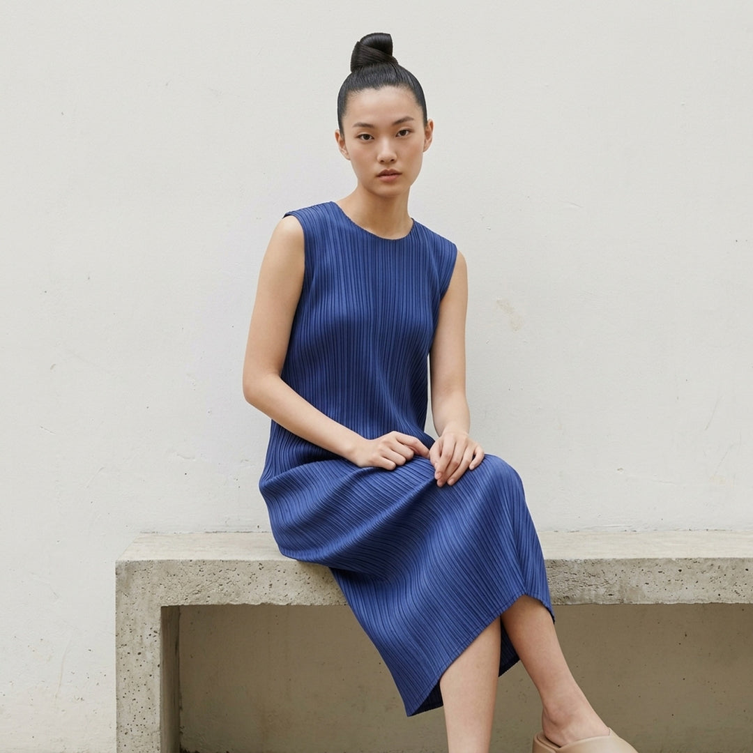 Pleats Please Issey Miyake Monthly Colors September sleeveless black midi dress with fine vertical micro-pleating throughout - lifestyle