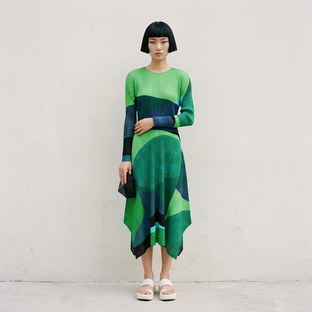 Pleats Please Issey Miyake Orbit long-sleeve pleated midi dress with abstract green, teal and navy colour-blocked print and asymmetric hem - lifestyle