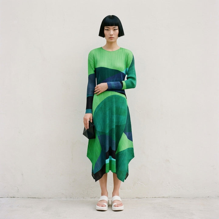 Pleats Please Issey Miyake Orbit long-sleeve pleated midi dress with abstract green, teal and navy colour-blocked print and asymmetric hem - lifestyle