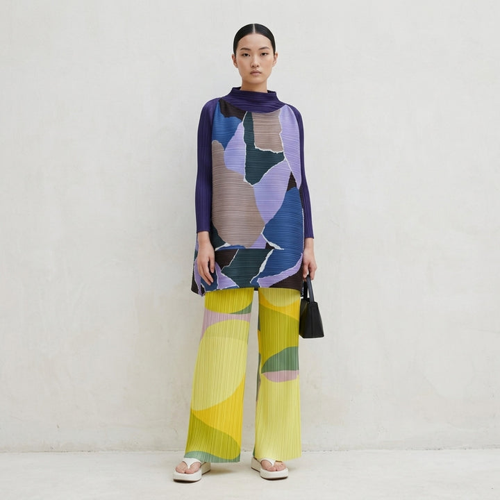 Pleats Please Issey Miyake Orbit wide-leg pleated pants with abstract green, teal, navy and black colour-block print - lifestyle